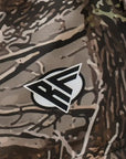 Close-up of RF-Wear Swim Trunks Tree Camo (Lined) in Tan with RF logo