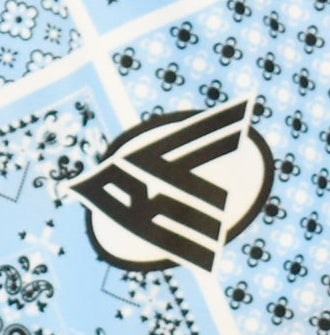 Close-up of RF-Wear Women's Bandana Patchwork Shorts in Blue with RF logo