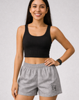 Woman wearing a black top and RF-Wear Women's Butterfly Shorts in Grey 