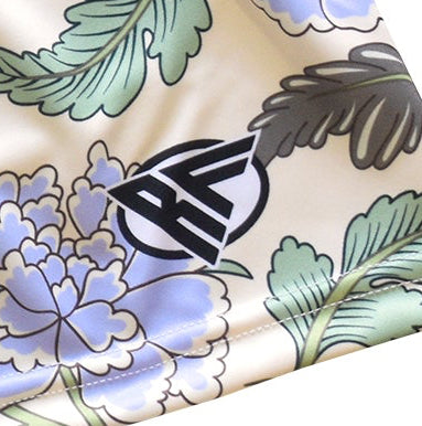 Close-up of RF-Wear Women's Carnation Shorts - Cream/Blue with RF logo