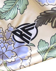 Close-up of RF-Wear Women's Carnation Shorts - Cream/Blue with RF logo