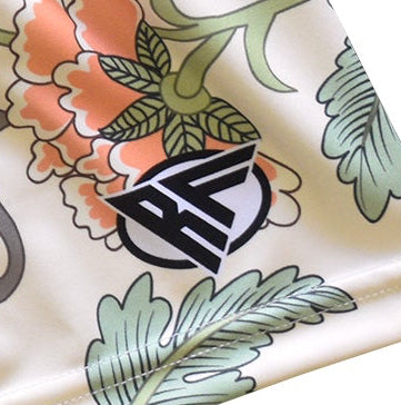 Close-up of RF-Wear Women's Carnation Shorts - Cream/Peach with RF logo
