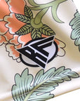 Close-up of RF-Wear Women's Carnation Shorts - Cream/Peach with RF logo