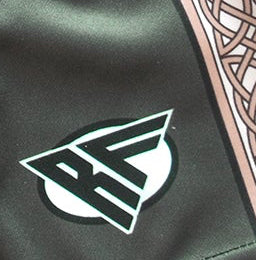 Close-up of RF-Wear Women's Celtic Cross Trim Shorts in Pine Green with RF logo