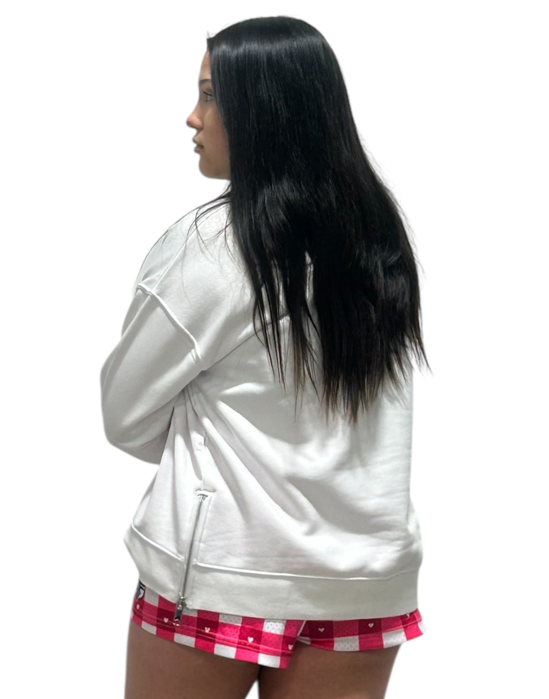 Picture of a women in a RF-Wear white hoodie and RF-Wear checkered/heart shorts in white and pinks.