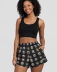 Woman wearing a black top and RF-Wear Women's Checkered Horror Faces Shorts in Black