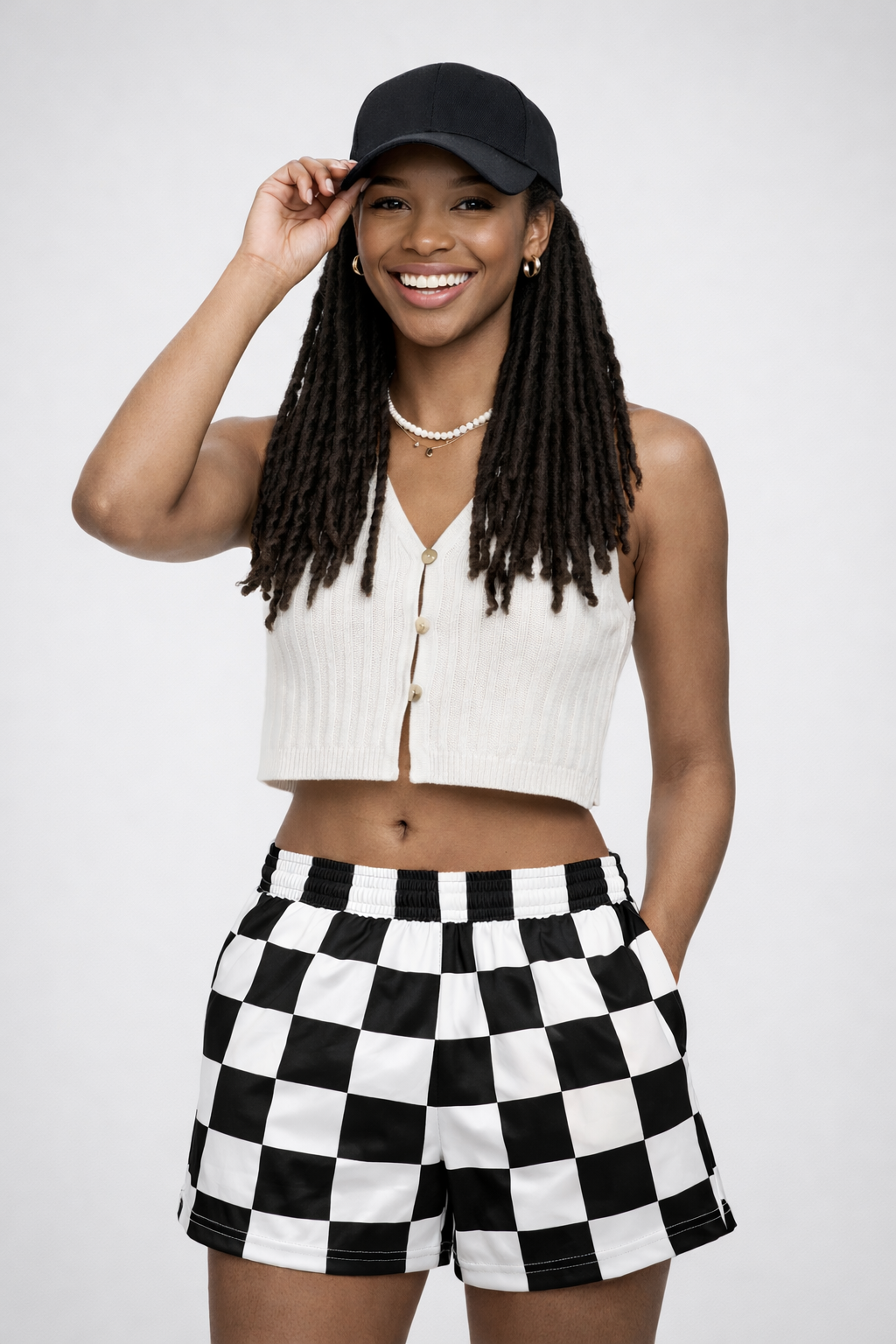 Woman wearing RF-Wear Women's Checkered Shorts in Black/White