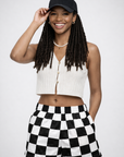 Woman wearing RF-Wear Women's Checkered Shorts in Black/White