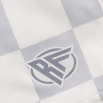 Close-up of RF-Wear Women's Checkered Shorts in Grey with RF logo