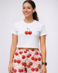 Woman wearing a white top and RF-Wear Women's Cherry Chevron Shorts in Pink/Red