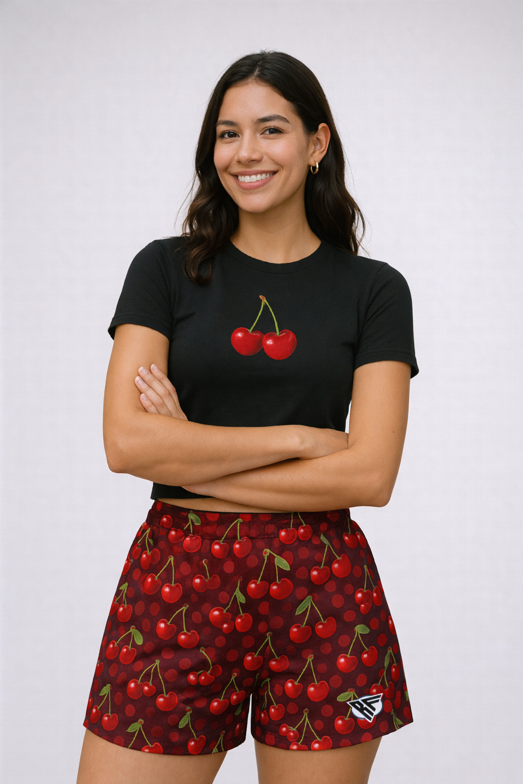 Woman wearing a black top and RF-Wear Women's Cherry Shorts in Light Red/Dark Red