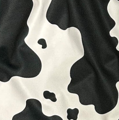 Close-up of RF-Wear Women's Animal Print Shorts - Cow in Black/White 