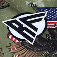 Close-up of RF-Wear Women's Eagle, Flags, Guns Shorts in Military Green with RF logo