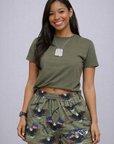 Woman wearing a green t-shirt and RF-Wear Women's Eagle, Flags, Guns Shorts in Military Green