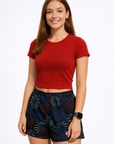 Woman wearing a red top and RF-Wear Women's Fireworks Shorts in Black Red/White/Blue