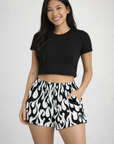 Woman wearing RF-Wear Women's Flame Shorts in Black/White 