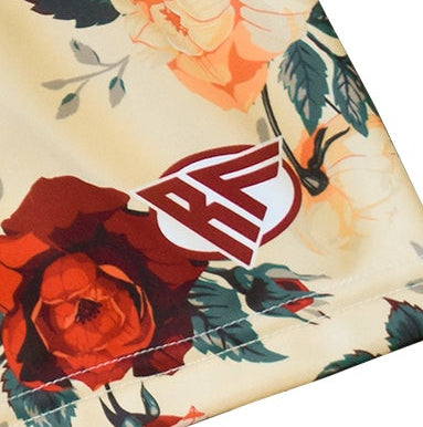 Close-up of RF-Wear Women's Floral Shorts in Cream/Red/Peach with RF logo.