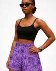 Woman wearing a black top and RF-Wear Women's Floral Shorts in Lavender/Black 