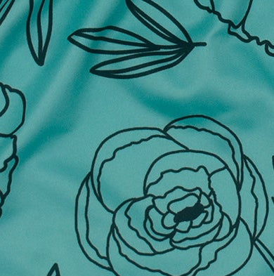 Close-up of RF-Wear Women's Floral Shorts in Teal/Black