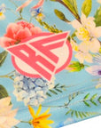 Close-up of RF-Wear Women's Floral Shorts in Teal/Multicolor with RF logo