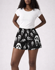 Woman wearing RF-Wear Women's Ghost Faces Shorts in Black with a white shirt