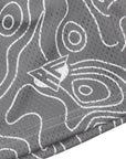 Close-up of RF-Wear Women's topography shorts in grey/white with RF logo