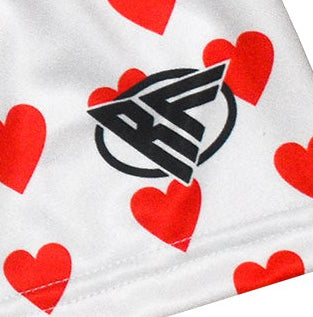 Close-up of RF-Wear Women's Mini Heart Shorts - White/Red with RF logo
