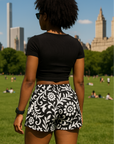 Woman at the park wearing RF-Wear Women's Paisley 2.0 Shorts - Black/White -  Back View