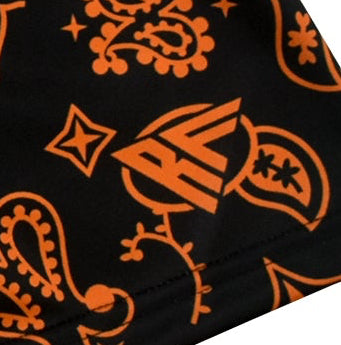 Close-up of  RF-Wear women's paisley shorts in Black/Orange with RF logo