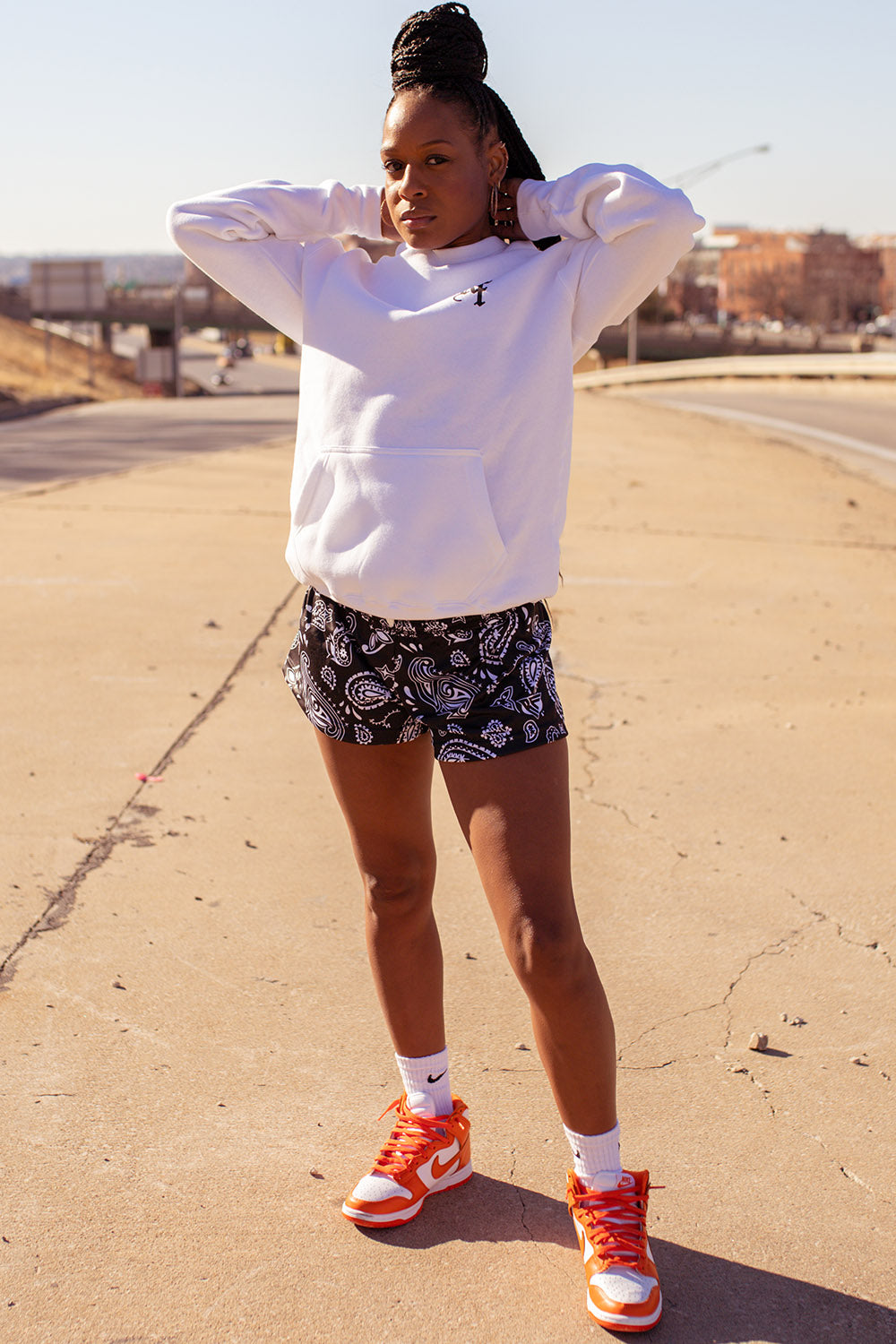 Woman standing wearing RF-Wear Women's Paisley Shorts - Black/White -Front View