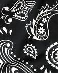 Close-up of black and white paisley print.