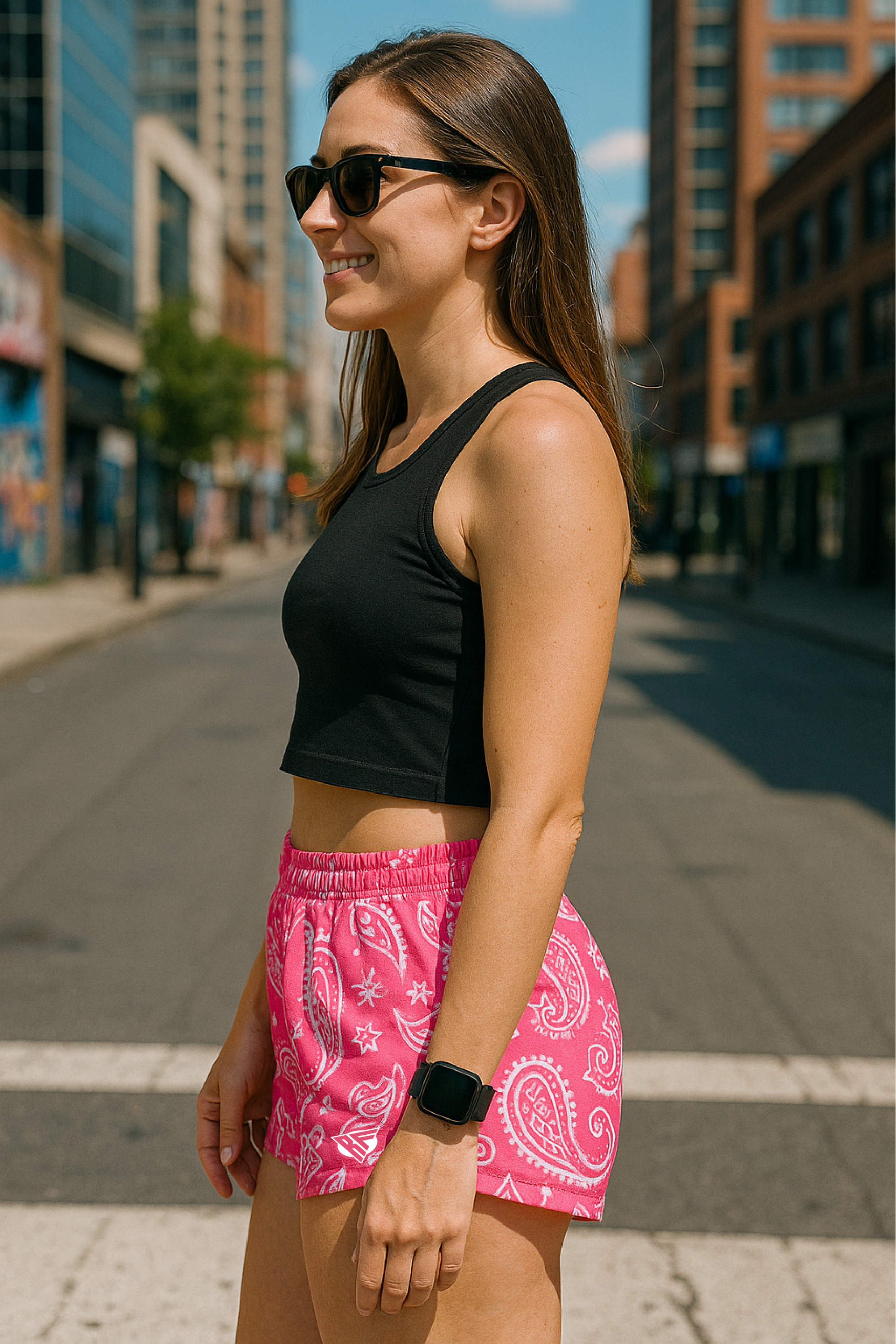 Woman standing wearing RF-Wear Women's Paisley Shorts - Fuchsia/White - Side View