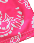 Close-up women's fuchsia/white paisley. bring with brand logo