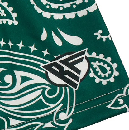 Close up of women's green/white paisley print with brand logo