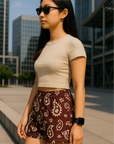 Woman standing in City wearing RF Wear Women's Paisley Shorts - Merlot/Cream - Side View