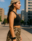 Woman standing on city sidewalk wearing RF-Wear Women's Paisley Shorts - Mocha/Cream - Side View