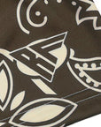 Close up of Women's Mocha/Cream Paisey pattern with brand logo