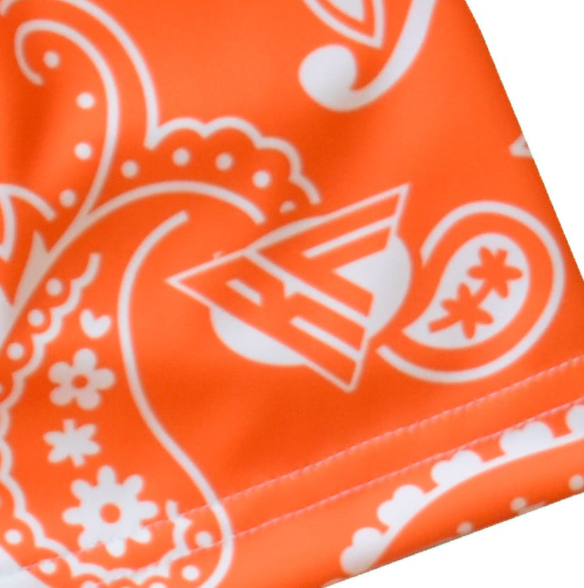 Close up of RF-Wear Orange/White paisley print with brand logo