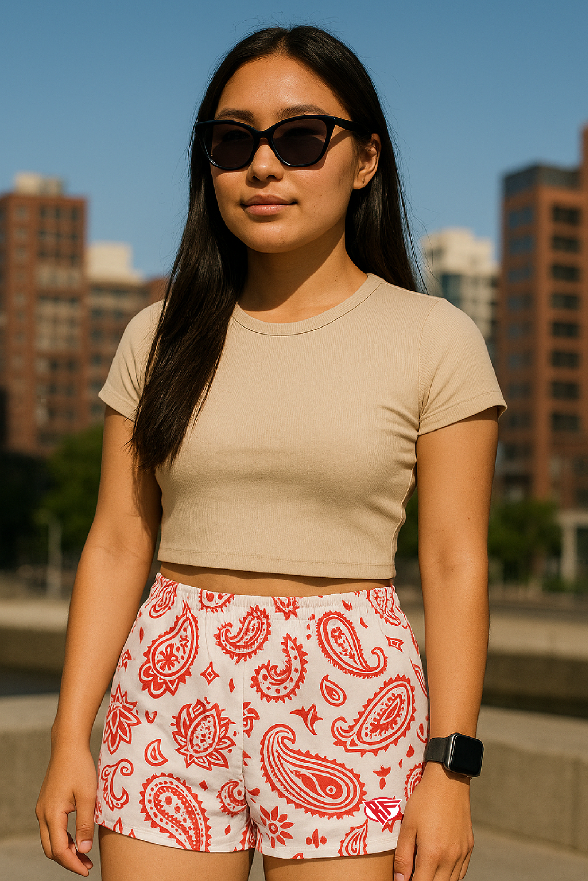 Woman standing in city wearing RF-Wear Women's Paisley Shorts - White/Red - Front View