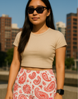 Woman standing in city wearing RF-Wear Women's Paisley Shorts - White/Red - Front View