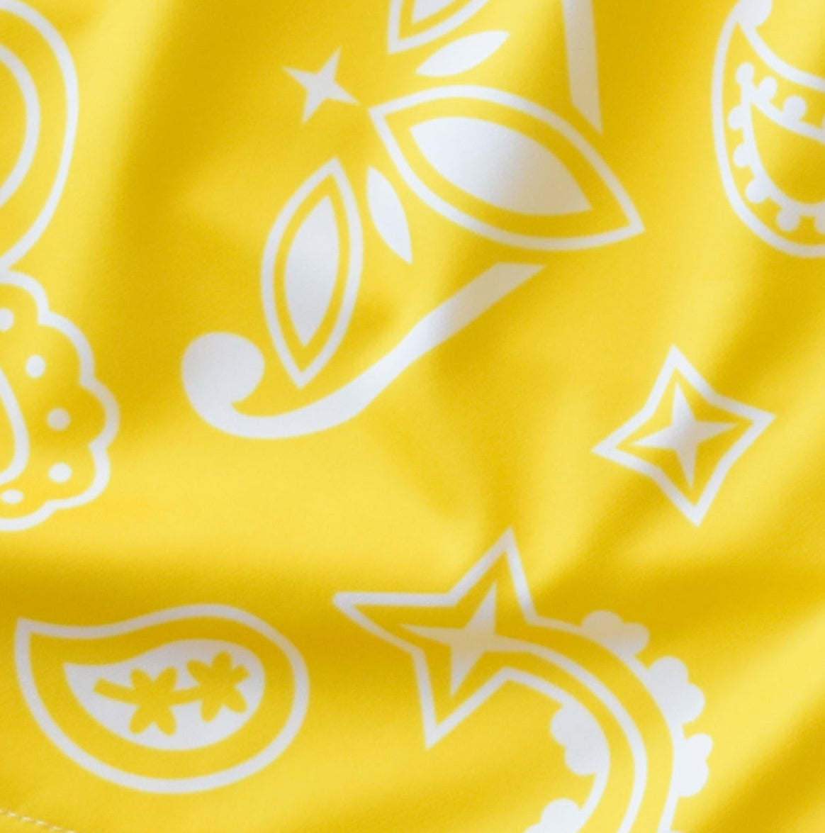 Close-up of women's paisley shorts in Yellow/White