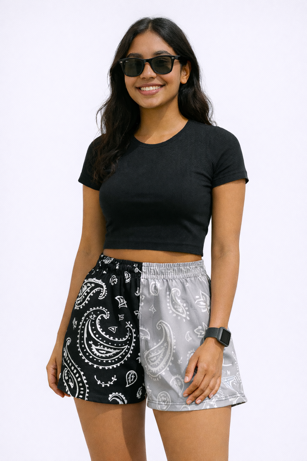 Woman wearing a black top and RF-Wear Women's Split Paisley Shorts in Black/Silver