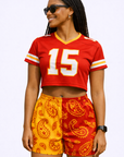 Woman wearing a cropped football jersey and RF-Wear Women's Split Paisley Shorts in Red/Gold