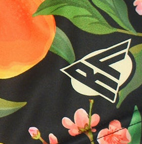 Close-up of RF-Wear Women's Peach Splash Shorts with RF logo
