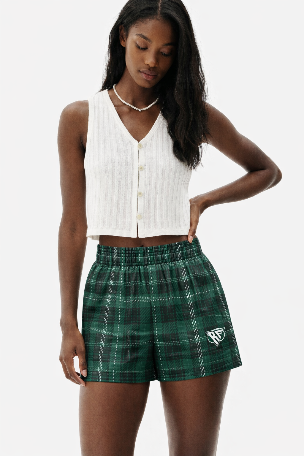 Woman wearing a white top and RF-Wear Women's Plaid Shorts in Green