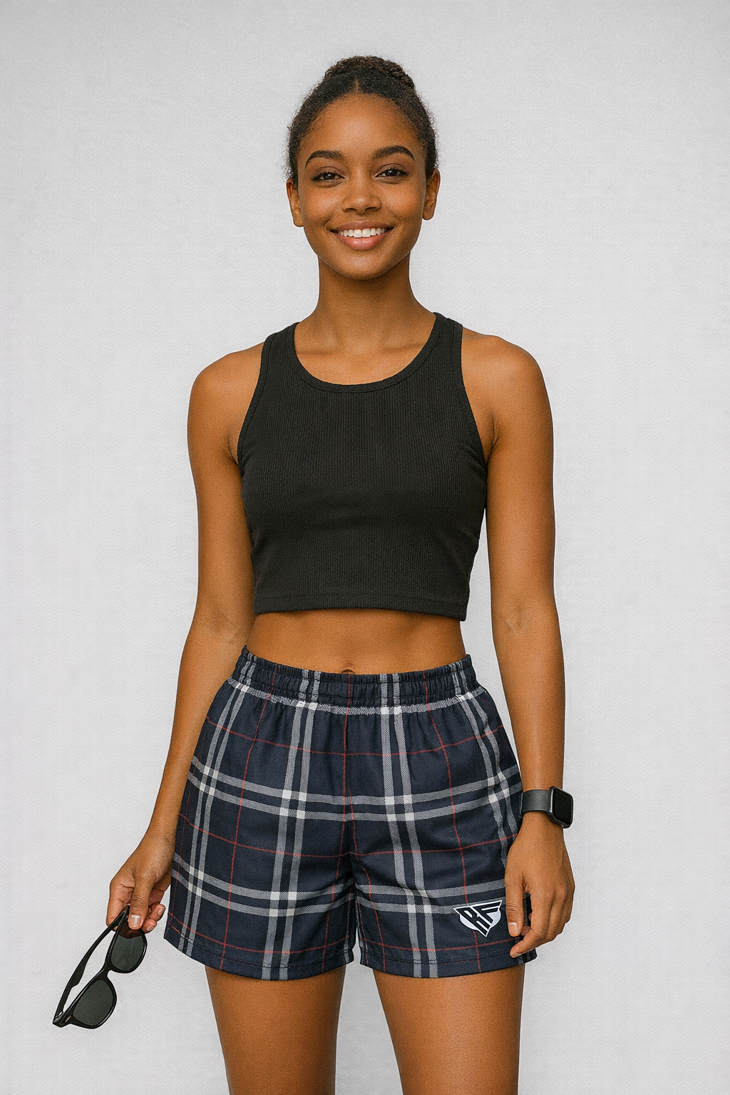Woman wearing a black top and RF-Wear Women's Tartan Plaid Shorts  in  Navy/White