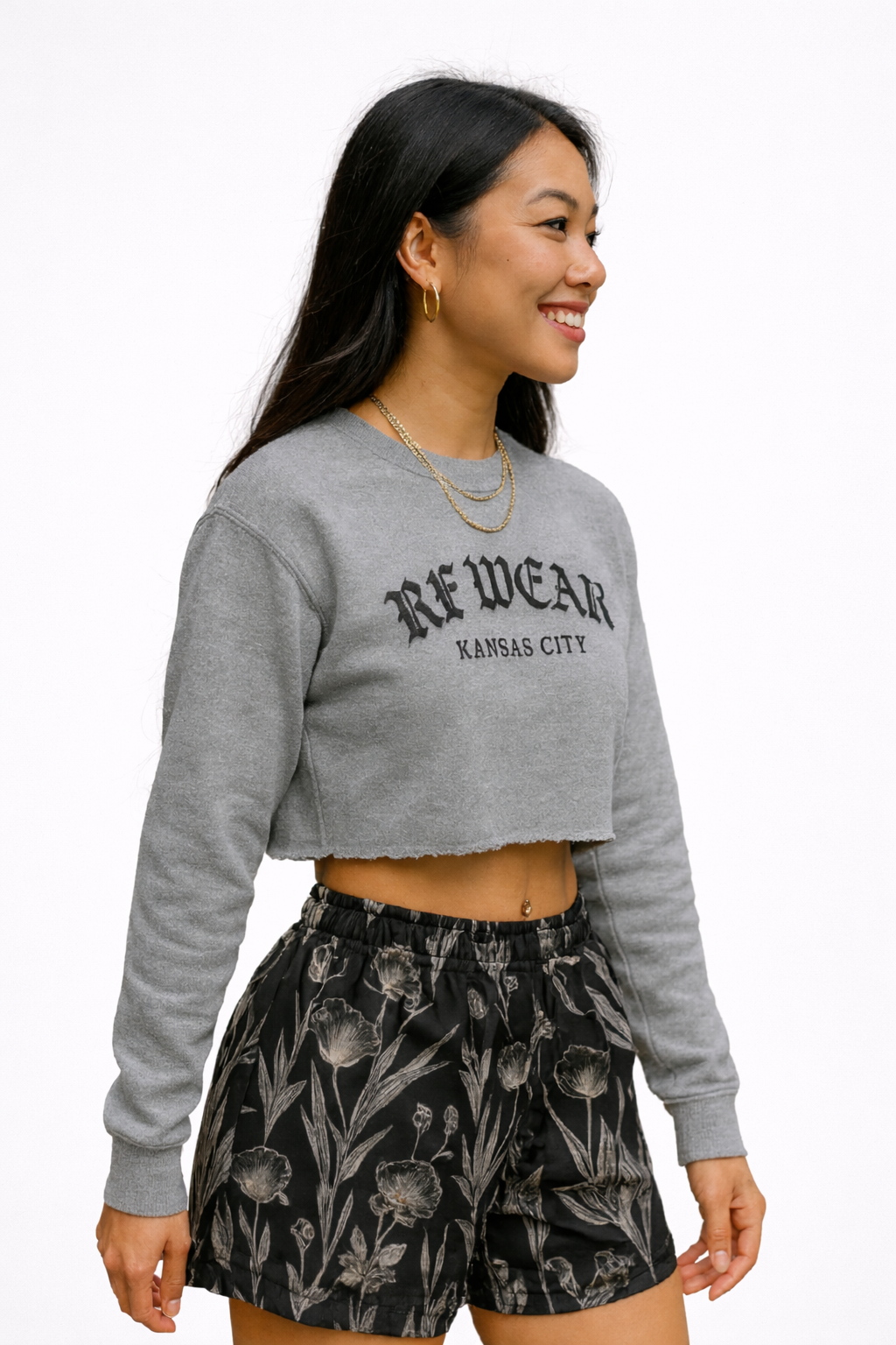 Woman wear a grey top and RF-Wear women's porcelain shorts in Black/White