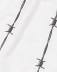 Close-up of RF-Wear Women's Reflective Logo Barbed Wire Shorts in White