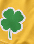 Close-up of RF-Wear Women's Shamrock Shorts in Gold