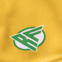 Close-up of RF-Wear Women's Shamrock Shorts in Gold with RF logo